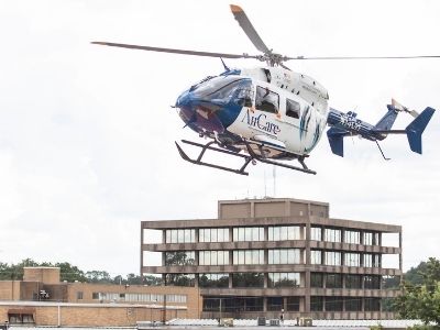 AirCare helicopter hovers above the landing pad.